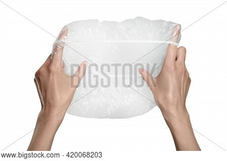 Woman Holding Transparent Shower Cap On Grey Background, Closeup