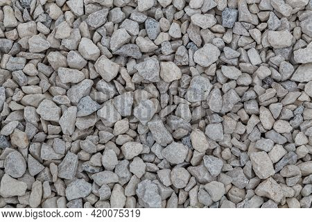 Dry White Limestone Ballast Flat Full Frame Background. Small Gray Dusty Broken Macadam Stones Textu
