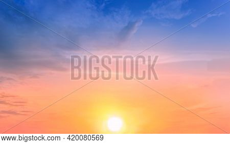 Beautiful Sky Painted By The Sun Leaving Bright Golden Shades.dense Clouds In Twilight Sky In Winter