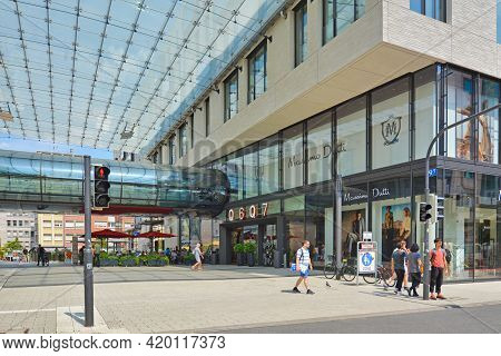 Mannheim, Germany - July 2019: Entrance Of Big Modern Shopping Center Called 'q6 Q7' With People In 