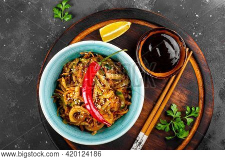 Traditional Asian Appetizer He Or Hwe, Squid Salad With Vegetables In A Bowl On The Wooden Board And