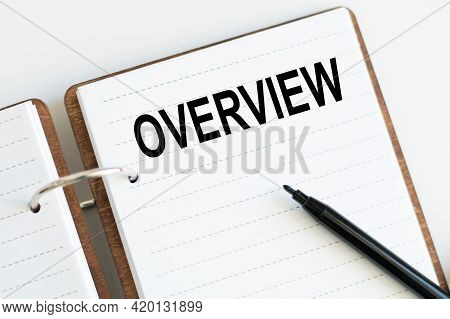 Notepad On Rings With Text Overview In The White Background