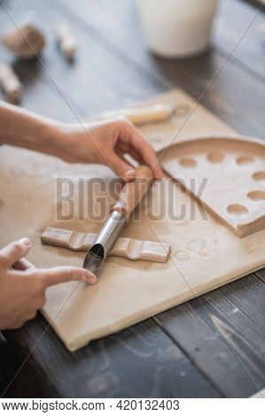 Craftsman Hands Connect The Clay Parts Made Of Raw Clay, Master Fingers Work With Pieces Of Clay, Fe