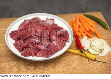 Cooking Pilaf In A Cauldron, A Recipe For Real Pilaf. Ingredients For Cooking Pilaf On A Wooden Back