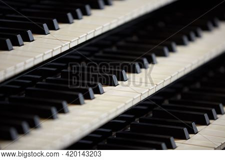 Simple Triple Pipe Organ Instrument Keyboard. Three Organ Keyboards Stack, Keys Closeup. 
Detail Of 