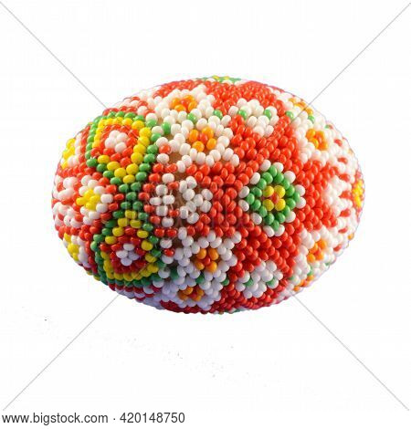 Closeup Of Some Beautiful Bead Work Designed Over A Chicken Egg And Isolated Over A White Background