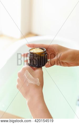 Closeup Shot Of Beautiful Female Hands Applying Moisturiser. Beauty Womans Hand Applying Cream