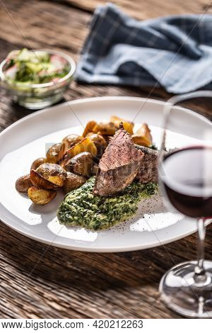 Red Wine As A Typical Baverage To A Red Meat Sous Vide Steak With Roasted Potatoes, Spinach Dip And 