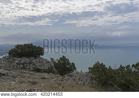 View From The Top Of Cape Alchac To Cape Meganom, Partially Hidden By Clouds. Sudak, Crimea. Cloudy,