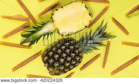 Fruit Roll Up With Pineapple On A Yellow Background Top View. Fruit Pastille. Vegan Homemade Sweets.