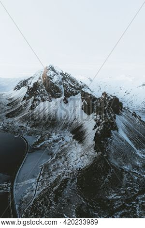 Drone view of a snow covered Eystrahorn mountain in Iceland