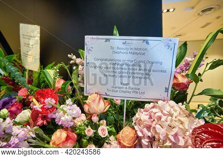 KUALA LUMPUR, MALAYSIA - JANUARY 18, 2020: close up shot of congratulation card with opening ceremony flowers at Sephora store in Fahrenheit 88 shopping mall in Kuala Lumpur.