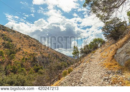 Scenic Landscape In The Mountains, Cloudy Sky And Mountain Slopes. Brac Island, Croatia.
