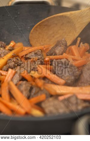 Cooking Pilaf In A Cauldron. A Step By Step Recipe For Cooking Pilaf, Cut The Beef Into Pieces And F