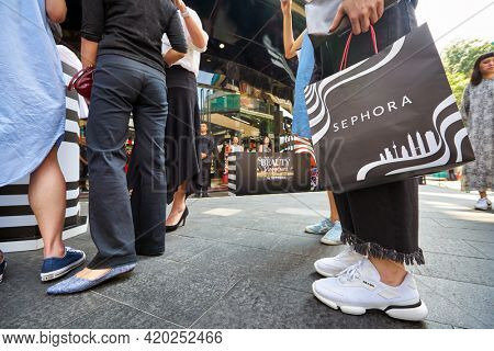 KUALA LUMPUR, MALAYSIA - JANUARY 18, 2020: a person stand with Sephora branded shopping bag on Sephora grand opening day at Fahrenheit 88 shopping mall in Kuala Lumpur.