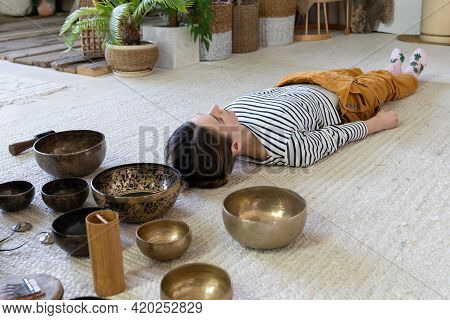 Sound Therapy For Meditation: Woman Meditate With Singing Bowls During Tibet Massage. Healing Tibeta