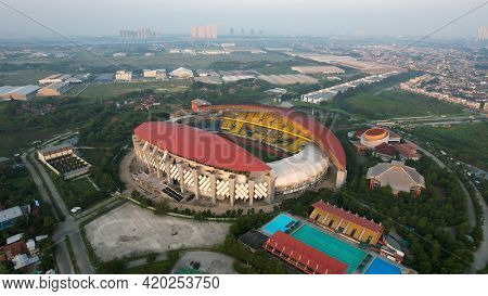 Aerial Top Down View Of The Beautiful Scenery Of Wibawa Mukti Stadium When Sunrise. With Bekasi City