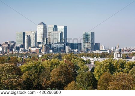 London, Uk - October 03, 2011. Green Spaces. Central London Uk City Skyline With Trees And Canary Wh