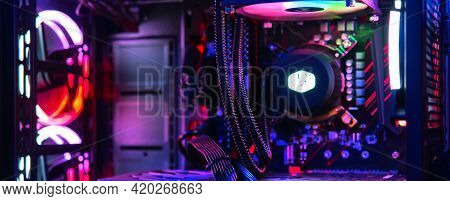 Top-end System Unit For Gaming Computer Close Up. Inside Of Illuminated Cybercafe, No People. Modern