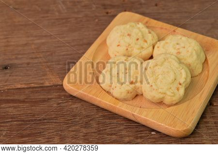 Malaysian Traditional Cookies Called As Kuih Bangkit Cheese On Wooden Plate Served During Eid Mubara