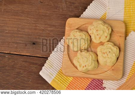 Malaysian Traditional Cookies Called As Kuih Bangkit Cheese On Wooden Plate Served During Eid Mubara