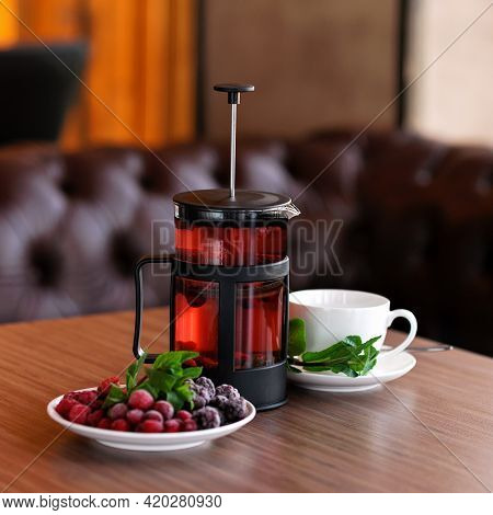 Brewed Tea Made From Frozen Berries, Blackberries, Raspberries And Cherries With Mint. Glass French 