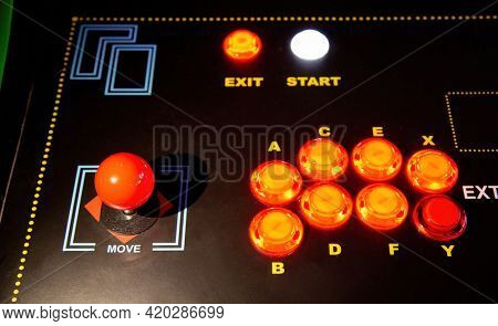 Gamepad with joystick and many colorful buttons. Retro arcade old video game stick control