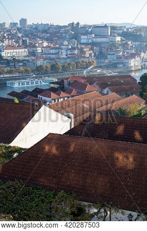 Panoramic View On Old Part Of Porto And Porto Loges Of Vila Nova De Gaia In Portugal At Sunrise