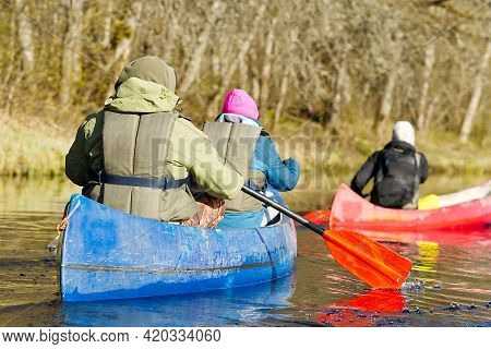 Family Canoeing On The River In The Early Morning. Joint Pastime, Entertainment, Outdoor Recreation,