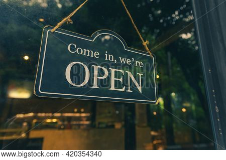 Come In, We Are Open - Open Sign Broad Hang On Entrance Door With Copy Space At Coffee Shop Or Resta