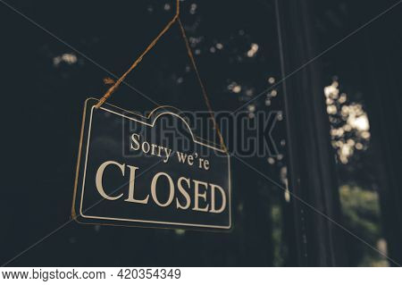 Sorry We Are Closed - Close Sign Broad Hanging Front Of Entrance Door With Copy Space At Coffee Shop