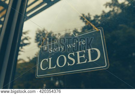 Sorry We Are Closed - Close Sign Broad Hanging Front Of Entrance Door With Copy Space At Coffee Shop