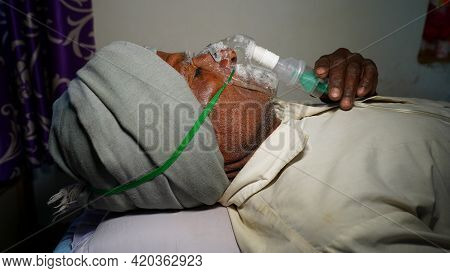 03 May 2021- Reengus, Sikar, India. Farmer Taking Emergency Oxygen With Cannula. Severe Causes Due T