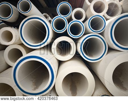 Polypropylene Pipes Stacked At Construction Site. Stack Of Ldpe Water Pipes. Pvc Pipes