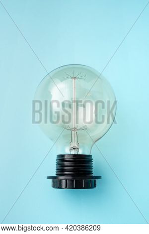Lamp On Plain Back Ground Presenting New Begining, Bulb On Blue Backdrop Showing New Opinion, One Li
