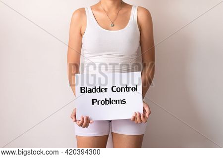 Woman Hands Holding A White Sign With The Word Bladder Control Problem On White Background