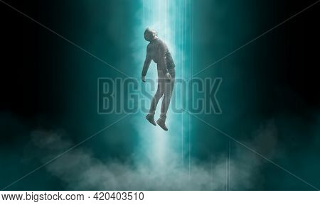 Man Being Abducted By Ufo - Alien Abduction Concept