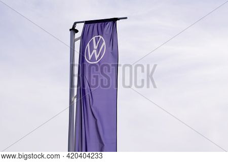 Bordeaux , Aquitaine France - 05 08 2021 : Volkswagen New Sign Vw Logo Car Brand On Flag Blue Front 