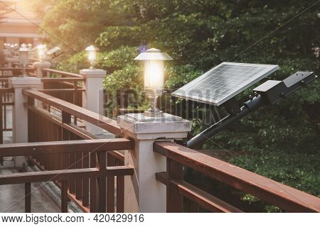 Solar Cell Panels And Modern Lamps Are Placed On Hotel Balcony To Illuminate And Save On Electricity