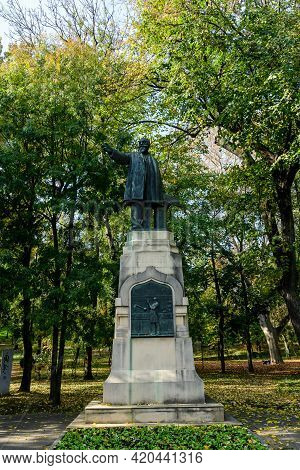 Bucharest, Romania, 7 November 2020: Statue Of Doctor Constantin Istrati Surrounded By Green Trees I