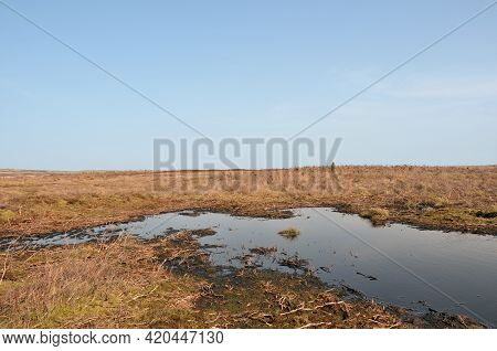 High Pennine Moorland On Midgley Moor In Calderdale With A Small Pond Reflecting The Sky Surrounded 