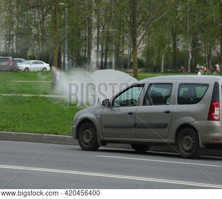 Water Vapor From An Open Car Hood On The Road, Ulitsa Podvoyskogo, Saint Petersburg, Russia, May 202