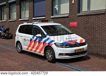 Amsterdam, Netherlands - July 7, 2017: Police Car Parked In Front Of Police Station In Amsterdam, Ne