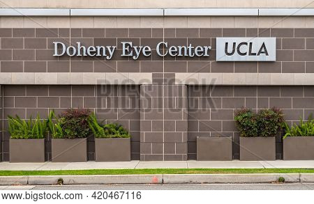 Pasadena, Ca, Usa - May 11, 2021: Ucla Doheny Eye Center Building And Sign With Green Ferns In Front