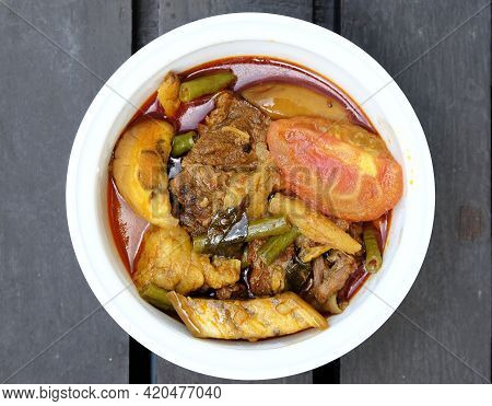 Flatlay Picture Of Beef Dalca Served During Eid Mubarak. Dalca Is A Stewed Vegetable Curry With Lent
