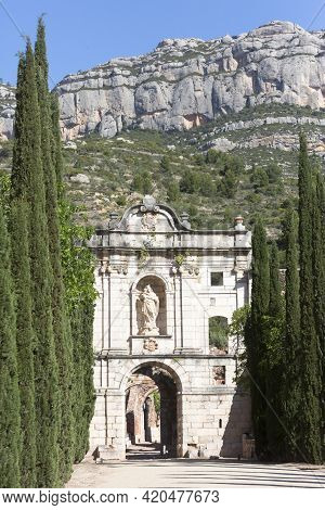 Tarragona, Spain, May 1, 2020 - Facade Ruins Of Monastery Cartoixa Escaladei In Catalonia On Backgro