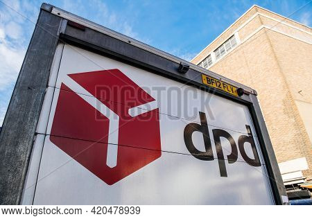 London, United Kingdom - Mar 9, 2017: Low Angle View Of Dpd Parcel Delivery Van Back In Front Of Bri