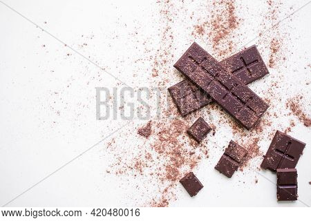 Bar Chocolate With Powder Chocolate On White Background.  World Chocolate Day And Snack Or Breakfast