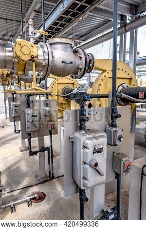 Pipes, Tubes, Machinery And Steam Turbine At A Power Plant