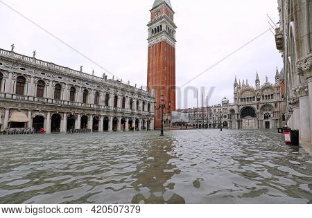 Saint Mark Square Also Called In Venice Piazza San Marco Completely Submerged In Water During High T